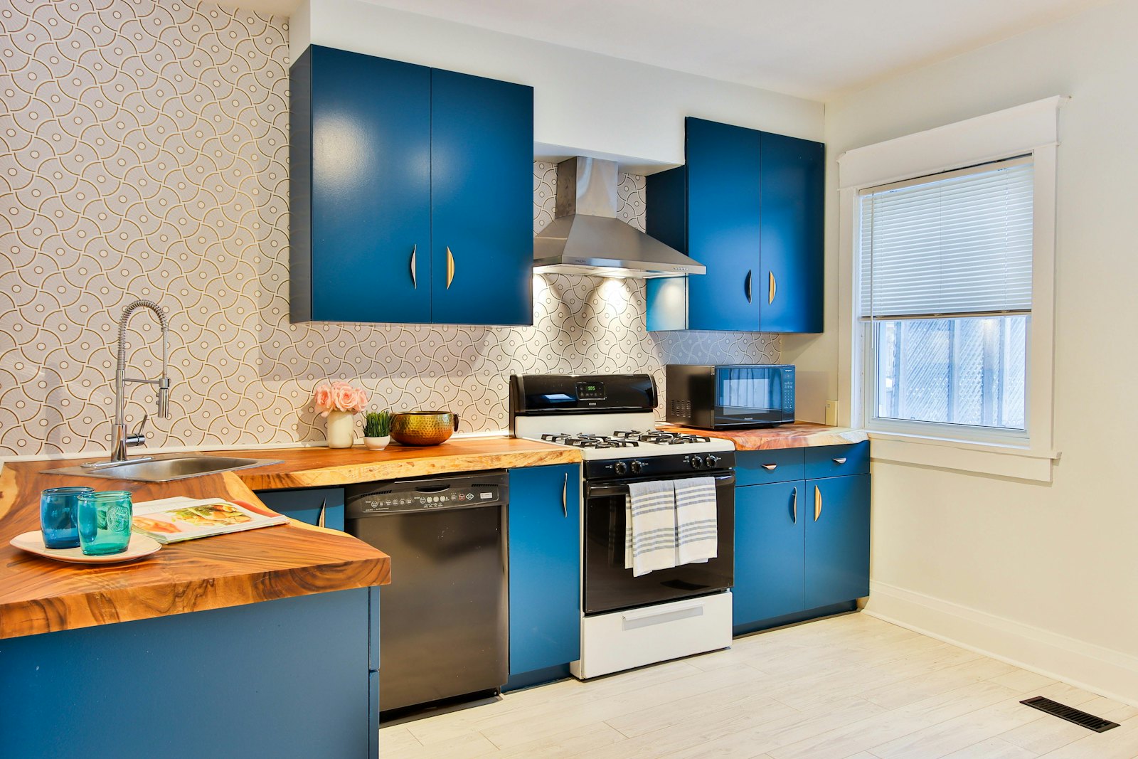 Fitted kitchen with white and wood cabinets